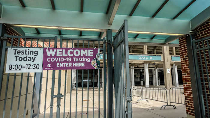 COVID-19 testing sign outside Spartan Stadium in East Lansing